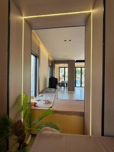 a room with a living room with a large mirror at Hotel Roden in Golem