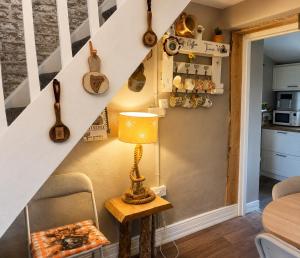 a table with a lamp on a table in a room at Daffodil Lodge in Sligo