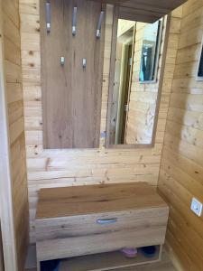 a wooden sauna with a wooden bench in a room at Apartman Bakic in Kolašin