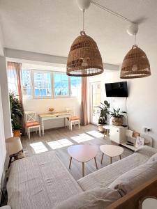 a living room with a couch and a table at Casa Iva in Igalo