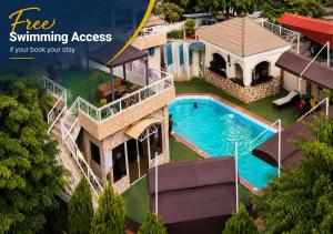 an image of a house with a swimming pool at Aneks Ibro Hotel, Wuse Zone 5, Abuja in Abuja +9 photos