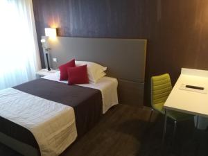 Postel nebo postele na pokoji v ubytování Hotel Toscana
