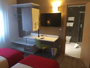 TV a/nebo společenská místnost v ubytování Hotel Toscana + 22 fotografií