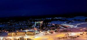 a ski resort in the snow at night at HimosKukkula, 140m2 in Jämsä
