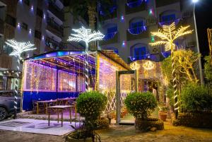 a building with christmas lights on it at Golden Sun Hotel - Hurghada in Hurghada