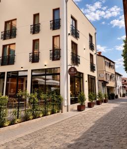 an empty street in front of a building at Hotel and Coffee Bar Old Bazaar in Skopje