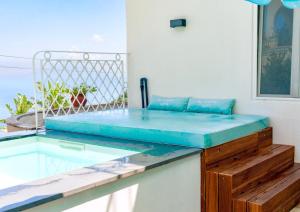a bed sitting on top of a table at Al Capri Suite & Private Pool in Capri
