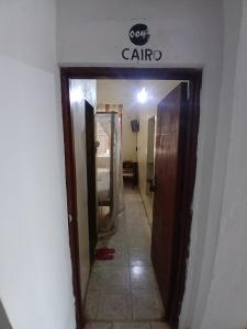 a hallway into a bathroom with a sign on the wall at Lamu Sunsail Hotel in Lamu +36 photos