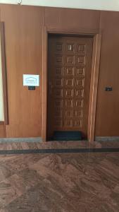 a door in a building with a sign on it at Casa Moscati in Avellino