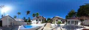 a house with a swimming pool in front of it at Vuai Bungalows & Restaurant in Kiwengwa