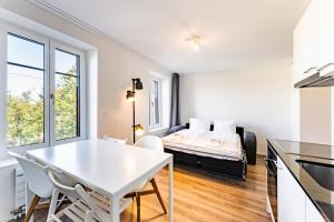 a white apartment with a bed in the background at TouchBed in St. Gallen