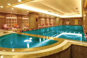 
a large swimming pool in a hotel room at Grand Central Hotel Shanghai in Shanghai

