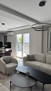 a living room with a couch and a table at Vila Manuela in Gevgelija