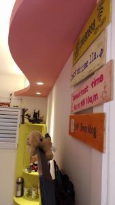 a room with a stuffed animal hanging on a wall at Mei Shan Ju in Nanzhuang