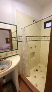 a bathroom with a sink and a shower at Hotel Casa Santos Guanajuato in Guanajuato +21 photos