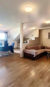 a bedroom with a bed and a table and a desk at Apartment Petra Zabok Horizon Suite in Zabok +39 photos