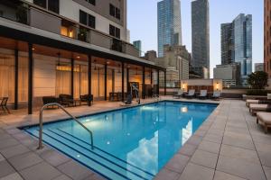 a swimming pool on the rooftop of a building at Holiday Inn Express Houston Downtown by IHG in Houston