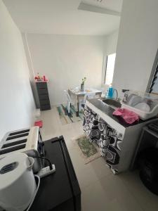 a kitchen with a sink and a counter top at Alexeis Place in Manolo Fortich
