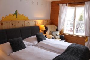Postel nebo postele na pokoji v ubytování Hotel Schlosswirt