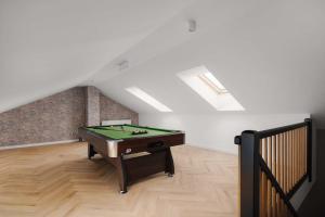 a room with a pool table in a attic at Ciche Tarasy in Stężyca