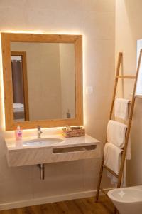 a bathroom with a sink and a mirror at Herdade do Cascalhar in Vila do Bispo