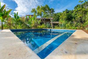 an image of a swimming pool in a house at Bahia Soul - Flow Beach House - Taipu de Fora - Península de Maraú in Barra Grande