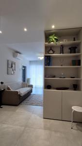 a living room with a couch and a table at Design apartment n. 41 in Trento