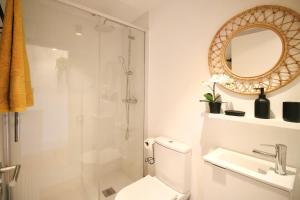 a bathroom with a shower and a toilet and a sink at Cantinho Da Lapa in Porto +8 photos