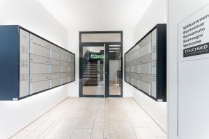 an empty hallway with a door in a building at TouchBed in St. Gallen