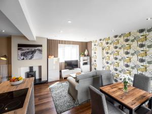 a living room with a couch and a table at North Star Apartment - Uk3446 in Greenhaugh