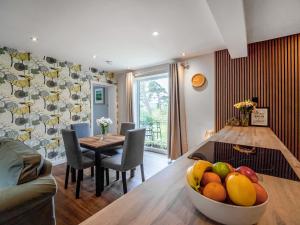 a kitchen and dining room with a bowl of fruit on a table at North Star Apartment - Uk3446 in Greenhaugh