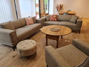 a living room with couches and a coffee table at Au B'Honneur de Blois in Blois +26 photos