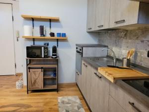 a kitchen with a sink and a counter top at The Blue Gem in Acqui Terme