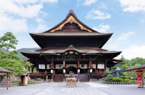 a large building with a roof on top of it at ヒカリとテラス in Nagano