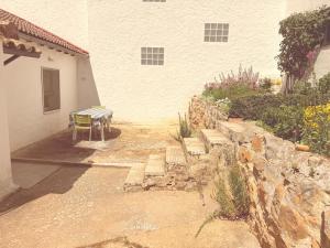 a bench sitting outside of a building next to a building at San Millán 1 in Soria
