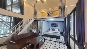 a hotel room with a bed and a staircase at Time Villa in Tam Ðảo +49 photos
