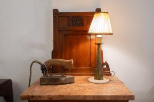 a lamp on top of a table with a chair at Aviyan Villa Wadduwa in Wadduwa