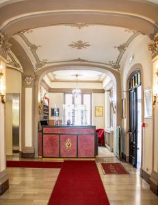 a large room with a red carpet and a podium at Hotel Antica Dogana in Turin