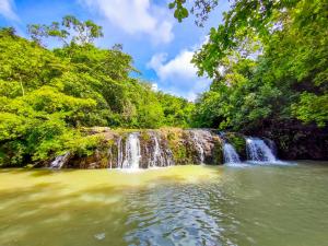 a waterfall in the middle of a body of water at Las Catalinas Ecológicas (El Maizal) in Antón