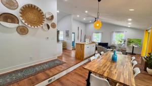 a dining room and living room with a wooden table at Meadow Sunrise in Bridgman