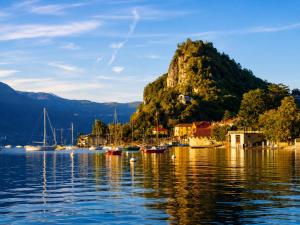 a small island in the water with boats in it at Apartment La Bigatera in Castelveccana