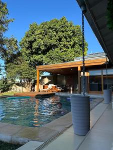 a man swimming in a swimming pool in a house at Charming house in countryside in Brotas