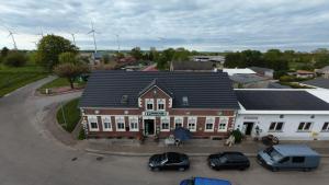 an overhead view of a building with cars parked in a parking lot at pinocchio pirow in Pirow