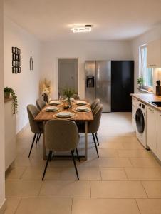 a kitchen and dining room with a table and chairs at Arcade Apartment Bad Oldesloe in Bad Oldesloe