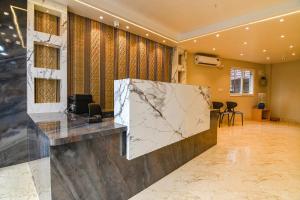 a lobby with a marble counter in a room at J P Guest House in Howrah