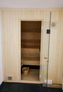 an inside of a sauna with a basket in it at Haus Pachole in Partenen