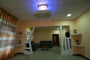 a hospital waiting room with a blue light on the ceiling at Rani Alfred in Viramanikkatevanturai