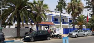 a group of cars parked in front of a building at Le Lagon Bleu Oualidia in Oualidia
