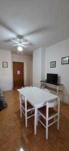 a living room with a white table and a ceiling at Civico 22 Guest House in Pellaro