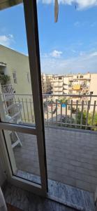 a view from a sliding glass door of a balcony at Civico 22 Guest House in Pellaro